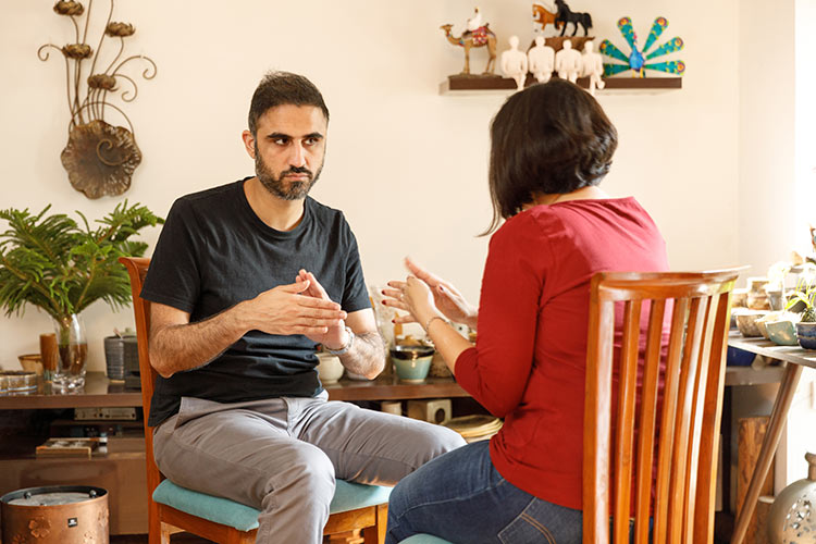 Man taking Emotional Freedom Technique EFT tapping sessions at home in Delhi, Gurgaon and Noida.